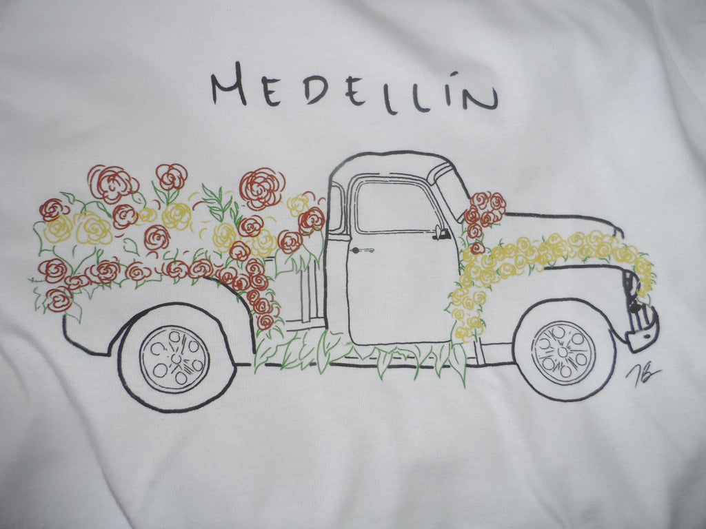 #07 Camiseta “Flores sobre ruedas” – Feria de Medellín
